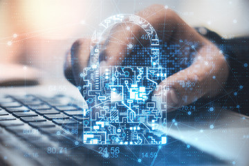 Poster - Businessman hands using laptop with glowing  circuit padlock
