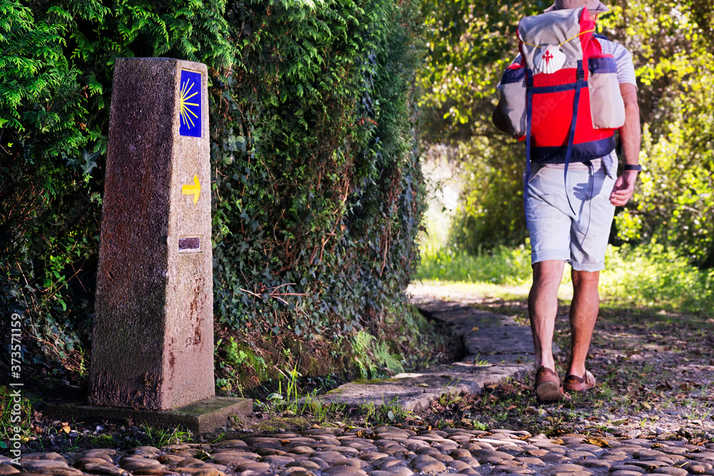 Camino de Santiago to Compostela ,stone cairn with yellow arrow and ...
