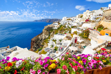 Wall Mural - View of the Aegean Sea and calder from the whitewashed city of Oia on the island of Santorini, Greece.