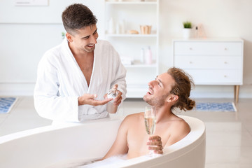 Canvas Print - Happy gay couple spending time in bathroom