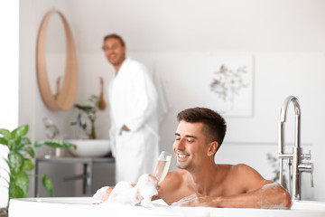 Canvas Print - Happy gay couple spending time in bathroom