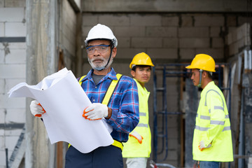 Aufkleber - Architect and construction workers working with blue print at construction site,Construction concept.