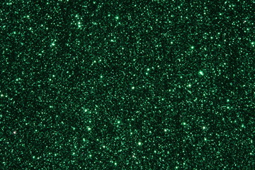 Green Sparkling Lights Festive background with texture. Abstract Christmas twinkled bright bokeh defocused and Falling stars. Winter Card or invitation	