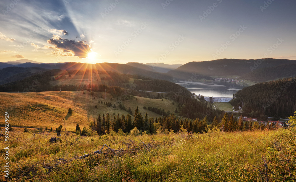 Landcape with sun, meadow, forest and mountain. - obrazy, fototapety, plakaty 
