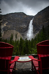 Sticker - Beautiful scenery of a powerful waterfall surrounded by rocky cliffs and trees in Canada