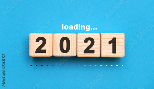 Photographie Loading 2021 years on wooden cubes on a blue background
