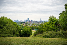 A View Across The Fields And Trees To The City Of London From The Parliament Hill Viewpoint In Hampstead Heath, London