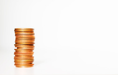 copper coin stack row growing pile on white background for money saving and investment business financial and banking concept.