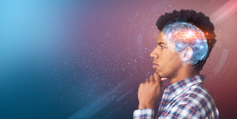 Serious intelligent black guy looking at copy space