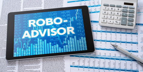 Wall Mural - a tablet with financial documents - robo-advisor