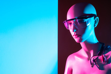 Poster - Artificial intelligence. Smart robot. A female robot with glasses next to the text space. Cyborg with wires. Managed human model.