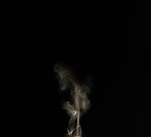 Cloud Of Smoke Rise From Lighter In Dark Environment With Black Background