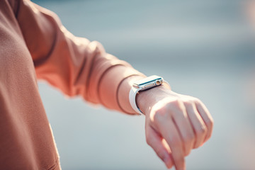 Woman using smart watches with checking pulse via health application. healthcare and people concept.