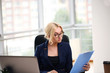 © ostap_davydiak - Adult young pretty business woman working at her office. She is very busy and hot.
