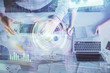 © peshkova - Double exposure of man and woman working together and data theme hologram drawing. Computer background. Top View.