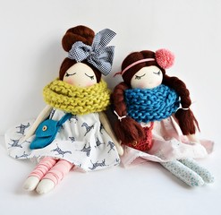 Wall Mural - Heirloom textile dolls wearing cute dresses, gaiters and knitted scarfs