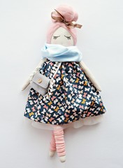 Wall Mural - Heirloom rag doll with pale pink hair, wearing navy dress, grey handbag and blue scarf 