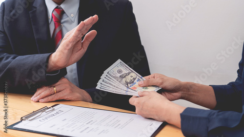 Cuadros en Lienzo Confident businessman manager rejecting an offer of money to agreement contract from partner or refusing to take bribe, Bribery and corruption concept