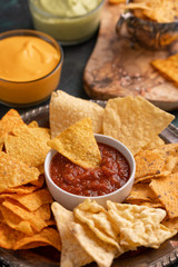 Wall Mural - Snacks and chips close-up with salsa, rest and snack for beer, Mexican food