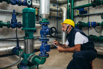 Wall Mural - industry worker working indoor in heating plant