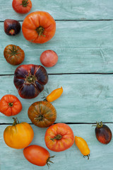 Canvas Print - assortment of tomatoes on turquoise wooden surface