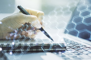 Poster - Creative abstract wireless technology hologram with hexagon and hand writing in diary on background with laptop, artificial intelligence and machine learning concept. Multi exposure