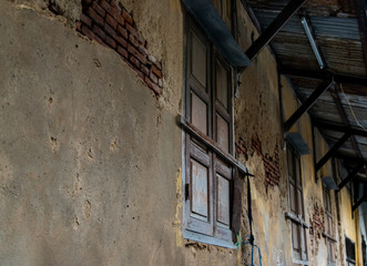 Wall Mural - Old wooden windows on the old wall. Traditional Architecture style, Selective focus.