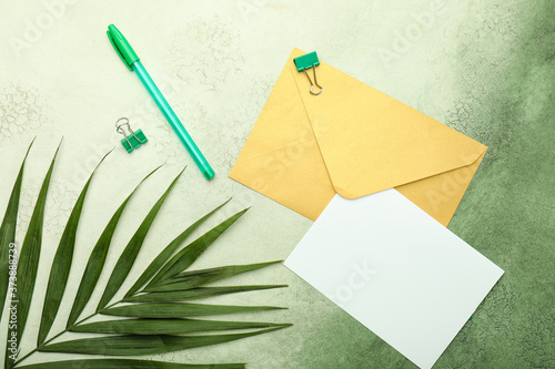 Fotomural Blank card with envelope and stationery on color background