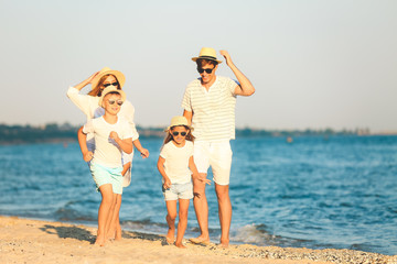 Poster - Happy family on sea beach at resort