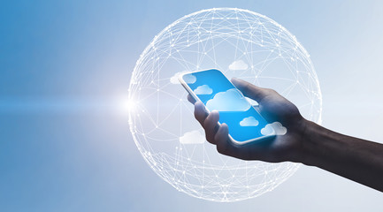 Poster - Cloud Computing. Hand holding smartphone with flying data storage cloud icons