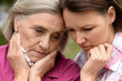 © aletia2011 - Close up portrait of sad senior woman with adult daughter