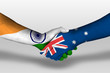 © prehistorik - Handshake between Australia and india flags painted on hands, illustration with clipping path.