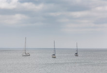 Several Anchored Sailboats Resting On The Sea To Soon Start A New Journey