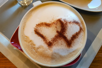 Wall Mural - Top view of a heart drawn on foam cappuccino