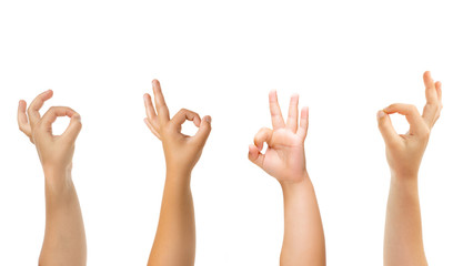 Wall Mural - Nice sign. Kids hands gesturing isolated on white studio background, copyspace for ad. Crowd of kids gesturing. Concept of childhood, education, preschool and school time. Signs and senses.