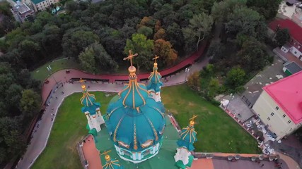 Wall Mural - Aerial top view of Saint Andrew's church and Andreevska street from above, cityscape of Podol district, city of Kiev (Kyiv), Ukraine