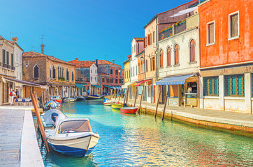 Wall Mural - Murano islands with water canal, boats and motor boats, colorful traditional buildings, Venetian Lagoon, Province of Venice, Veneto Region, Northern Italy. Murano postcard cityscape.