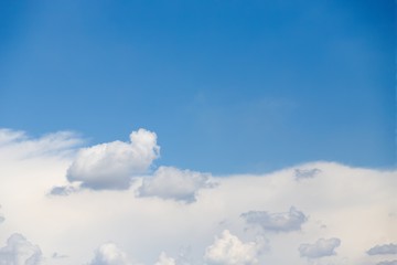 Wall Mural - Clear blue sky and white clouds. Half of the blue sky, half white cloud. Copy space