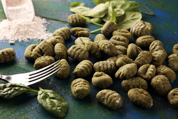 Wall Mural - hand made gnocchi with fresh Spinach. italian traditional gnocchi on background