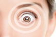 © Maridav - Hypnosis spiral over Asian woman face of hypnotized girl portrait background.