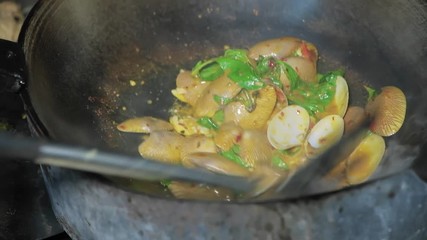 Wall Mural - Close up Cooking Thai seafood Stir Fried Clams with Roasted Chili paste on frying pan in the kitchen