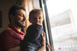 © Antonio Recena - Father plays with his little boy less than a year by the window
