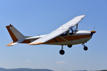 A Small Sports Single-engine Plane Is Flying