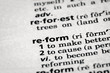Dictionary definition of the word reform in focus. Concept of change and improvement.