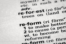 Dictionary Definition Of The Word Reform In Focus. Concept Of Change And Improvement.