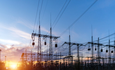 Wall Mural - high-voltage power lines at sunset or sunrise. high voltage electric transmission tower