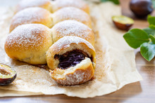 Filled Doughnuts With Plums And Cinnamon. High Quality Photo