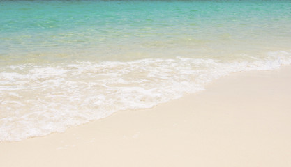 Wall Mural -  Blue sea ocean, water sun reflection, and sand background.