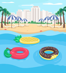 Poster - Seaside resort and pool floats flat color vector illustration. Apple and pineapple floats. Empty city beach. Summer recreation 2D cartoon landscape with cityscape on background