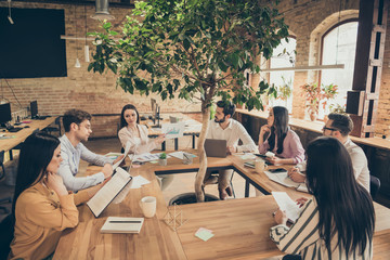 Sticker - Photo of business people partners sit around table spacious office seven members successful new anti crisis crash plan professionals discussing observe graphics charts 2020 ending indoors